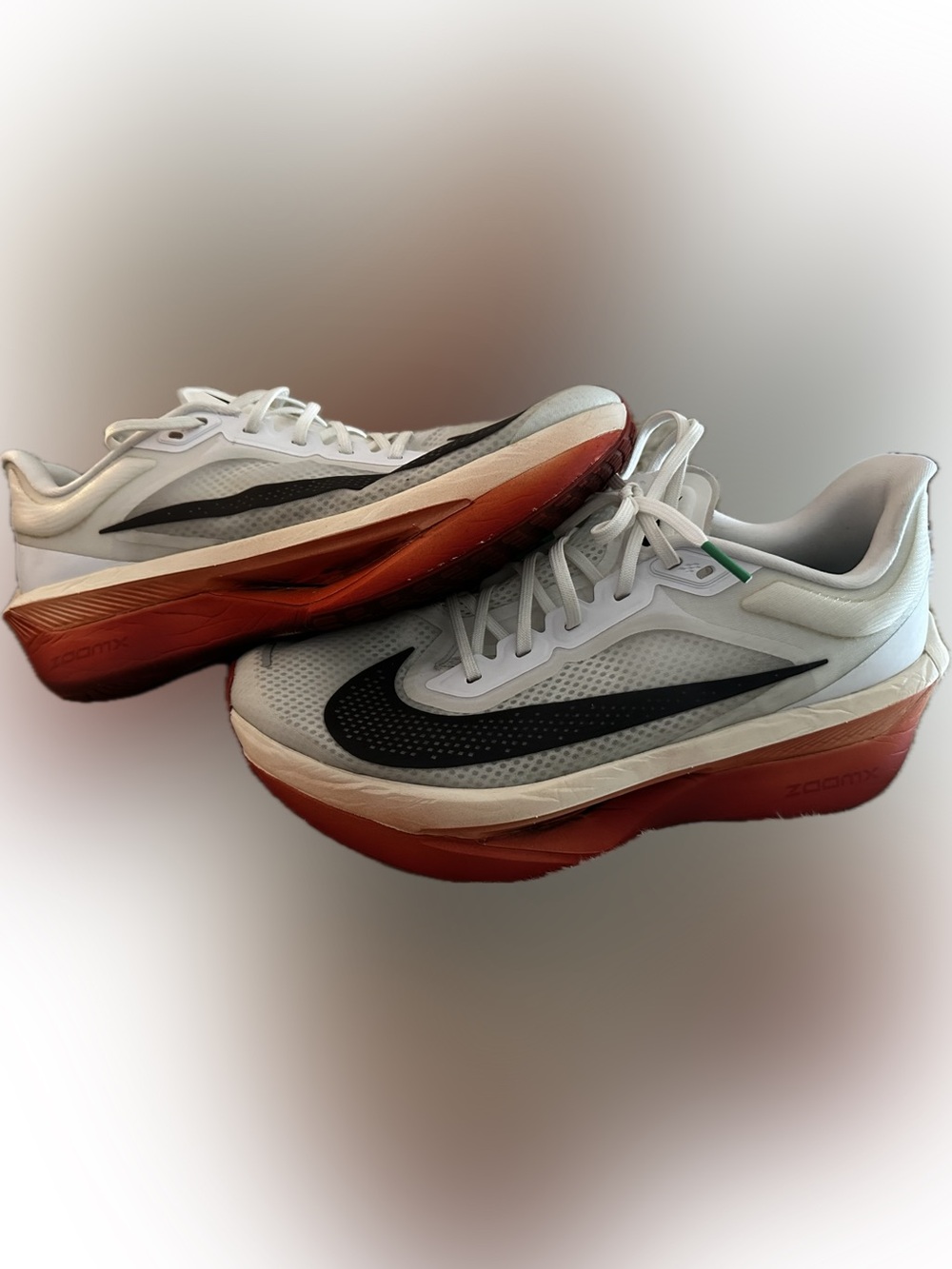 Nike Zoom MFLY 6 White Sneakers with Black Swoosh and Red-Orange Gradient Sole